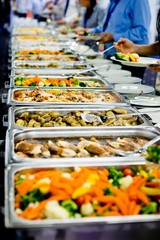 People taking food from professional warm catering.