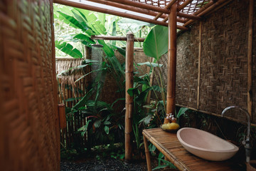 Outdoor shower in nature Bamboo wood surrounded Giving a natural feeling of freshness.Tropical Outdoor Shower on bamboo wall