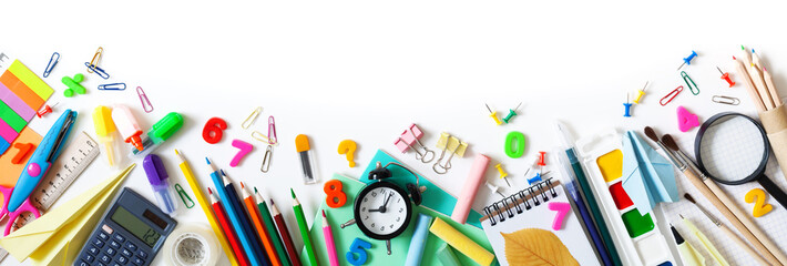 Set of different stationery, alarm clock and supplies on white background. Back to school concept. Banner format. Top view.