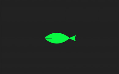 Minimalist design. Fish shape filled with green color in the middle of a dark gray textured background.
