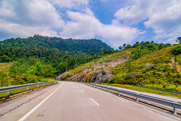 empty road in the middle of tropical forest at Fraser Hill, Malaysia