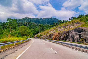 empty road in the middle of tropical forest at Fraser Hill, Malaysia