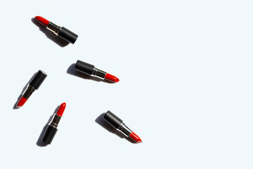 Flat lay composition, Lipsticks on white background with shadow. Beautiful Make-up concept