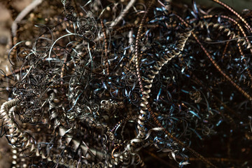 Close-up of twisted spiral steel shavings. Abstract background