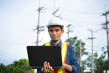 Engineer holding computer  working on side technology