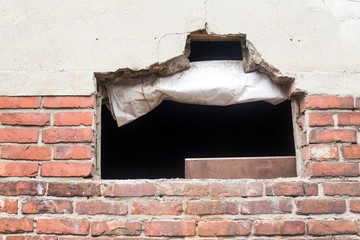 Brick wall of old red bricks with big Hollow