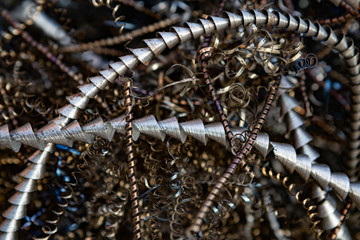 Close-up of twisted spiral steel shavings. Abstract background