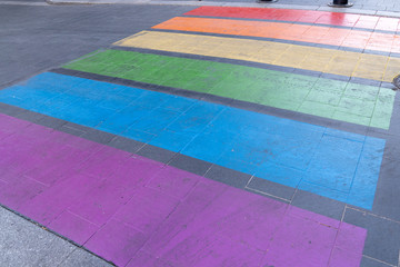gay friendly urban crossway in rainbow flag LGBT pedestrian crossing