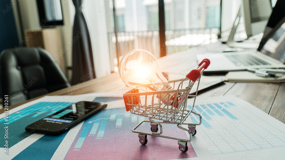 Poster innovation and inspiration concept, abstract symbol. light bulb glowing in shopping cart on business