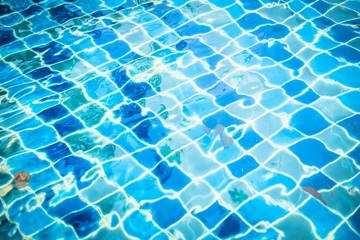 Blue Pool with autumn leaves with a waterfall.