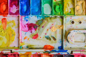 Paint and colorful trays prepared for art