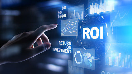 ROI Return on investment reading revenue business concept on virtual screen.
