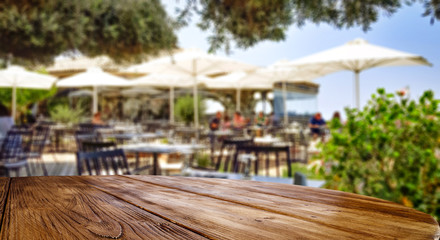 Desk of free space and restaurant background 