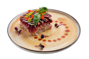 Salad with herring, beet, potato, carrot and caviar isolated on white