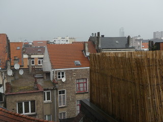 Fototapeta premium Old rooftops. Old windows. Roof terrace. Satellite dishes on the building.