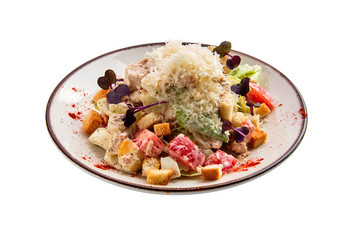 Salad with chicken, cheese, tomato, cabbage and crouton isolated on white