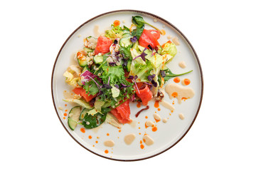 Salad with smoked salmon and fresh vegetables isolated on white