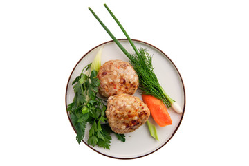 Meatballs served with fresh carrot, spring onion and parsey