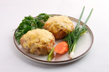 Cutlet covered with melted cheese served with fresh carrot, spring onion and parsey