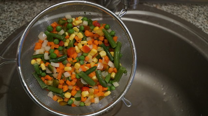 Mix of vegetables. Green asparagus beans, yellow corn, orange carrots, red pepper.