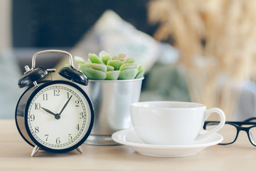 Fototapeta na wymiar Morning sun. Alarm clock on a beautiful background