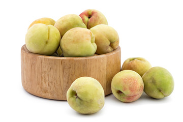 Fresh ripe organic peaches in wooden bowl, Prunus persica, isolated on white background. Vinogradarska breskva. Šeftelija