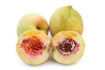 Fresh ripe organic peaches, Prunus persica, one cutted on half, isolated on white background. Vinogradarska breskva. Šeftelija