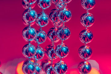 close up of silver beads. christmas and holiday decoration concept