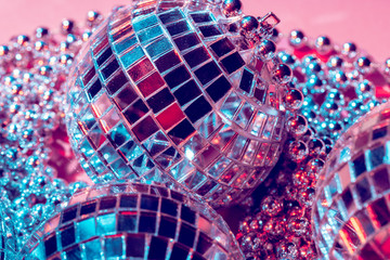 disco balls for decorationof a party on  pink  background