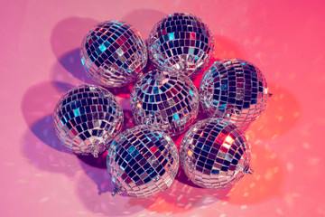 disco balls for decorationof a party on  pink  background