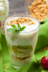 Healthy summer breakfast. Jar with granola, yoghurt and strawberry