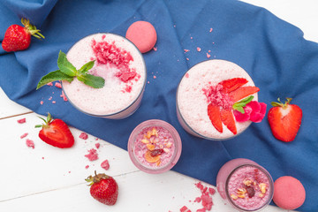 Composition with healthy food. Strawberries and yoghurt breakfast on table