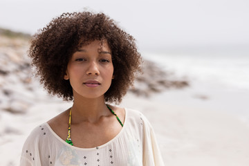 Woman standing at beach on a sunny day
