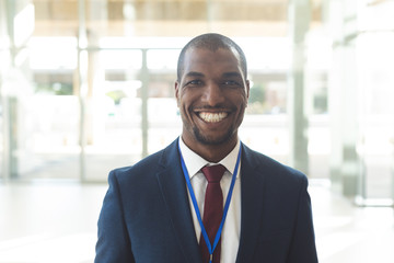 Mature African-american male standing in conference room, smiling to camera