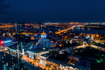 Fototapeta na wymiar Night City, Aerial View European midtown after sunset, drone shot
