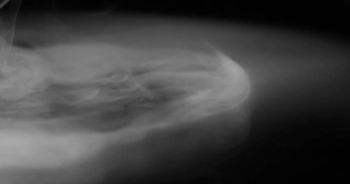 Misty Space. Heavy white smoke slowly spreads over the black surface gradually dissolving