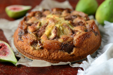 Fig cake on wooden table. Selective focus