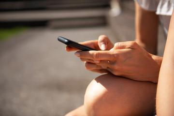 Women hands Typing on mobile phone