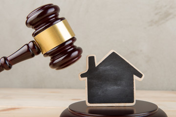 Real estate concept -auction gavel and little house with copy space