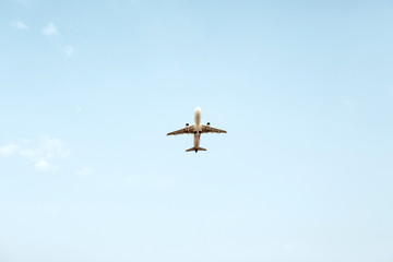 Airplane flying in blue sky. Travel, vacation and holiday concept.