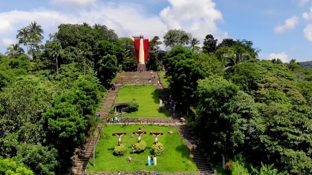 Aerial drone footage of beautiful salute Jesus at Kamay ni Hesus healing Catholic church.
