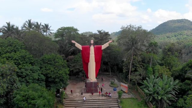 Aerial drone footage of beautiful salute Jesus at Kamay ni Hesus healing Catholic church.