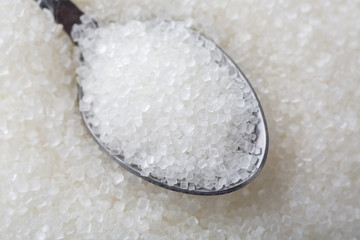 Closeup of spoon with white sugar