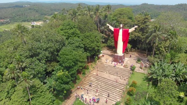 Aerial drone footage of beautiful salute Jesus at Kamay ni Hesus healing Catholic church.