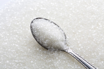 Closeup of spoon with white sugar
