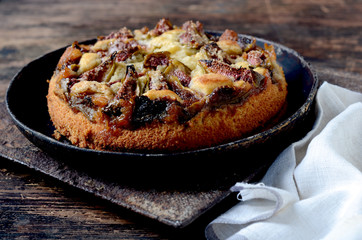 Fig cake on wooden table. Selective focus