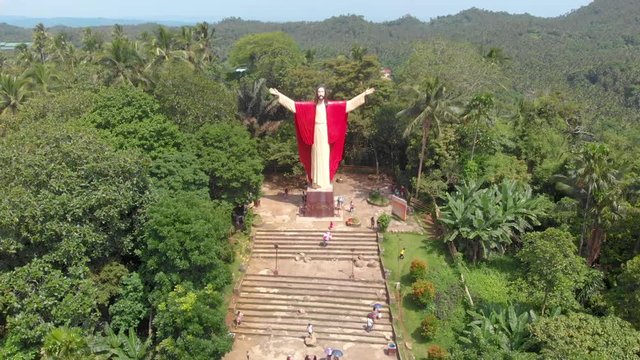 Aerial drone footage of beautiful salute Jesus at Kamay ni Hesus healing Catholic church.