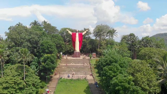 Aerial drone footage of beautiful salute Jesus at Kamay ni Hesus healing Catholic church.