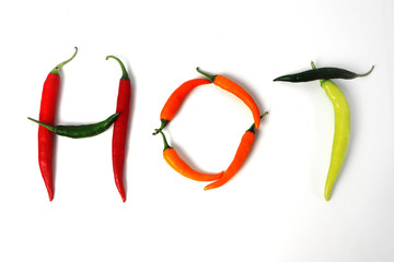 The word hot built of chili peppers on a white background. Isolated