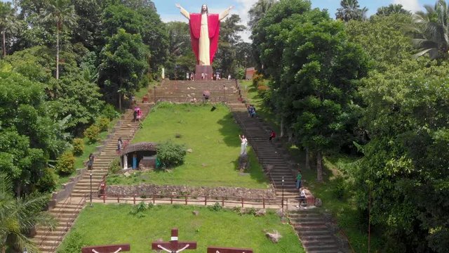 Aerial drone footage of beautiful salute Jesus at Kamay ni Hesus healing Catholic church.